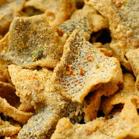 IRVINS Salted Egg Salmon Skin Chips Hand Cooked image highlights premium artisan crunch