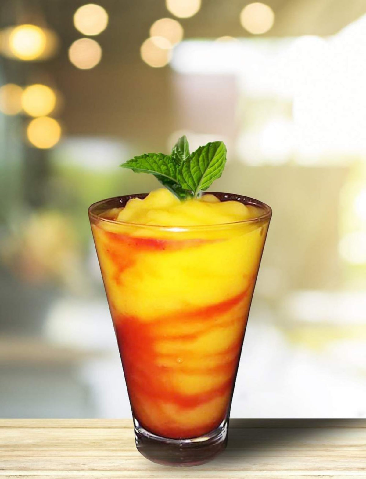 Isolate Mango Mix being poured into a glass for mango cocktails and margaritas.