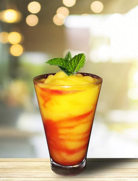 Isolate Mango Mix being poured into a glass for mango cocktails and margaritas.