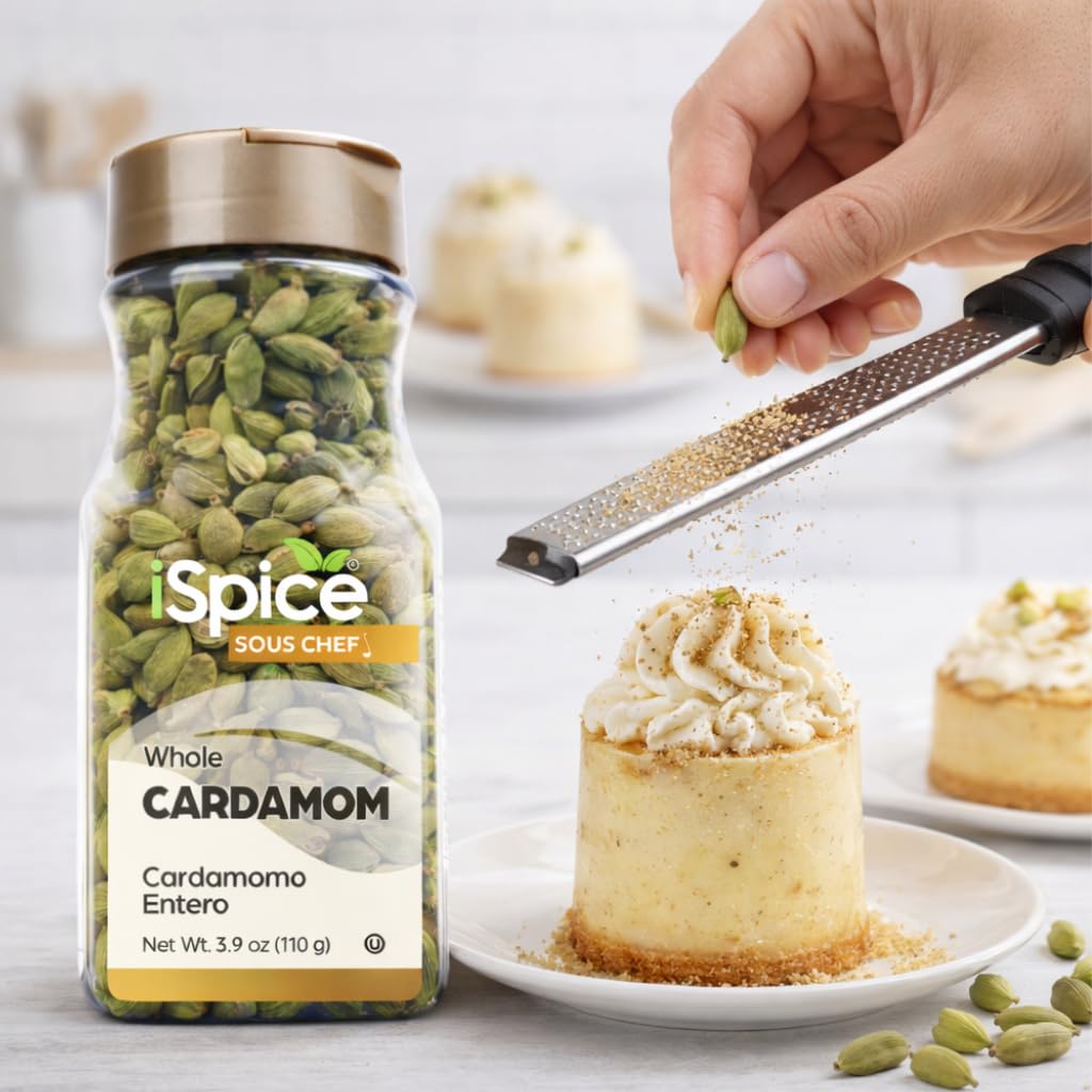 iSpice Cardamom Seeds sprinkled into a dish, adding depth and warmth.