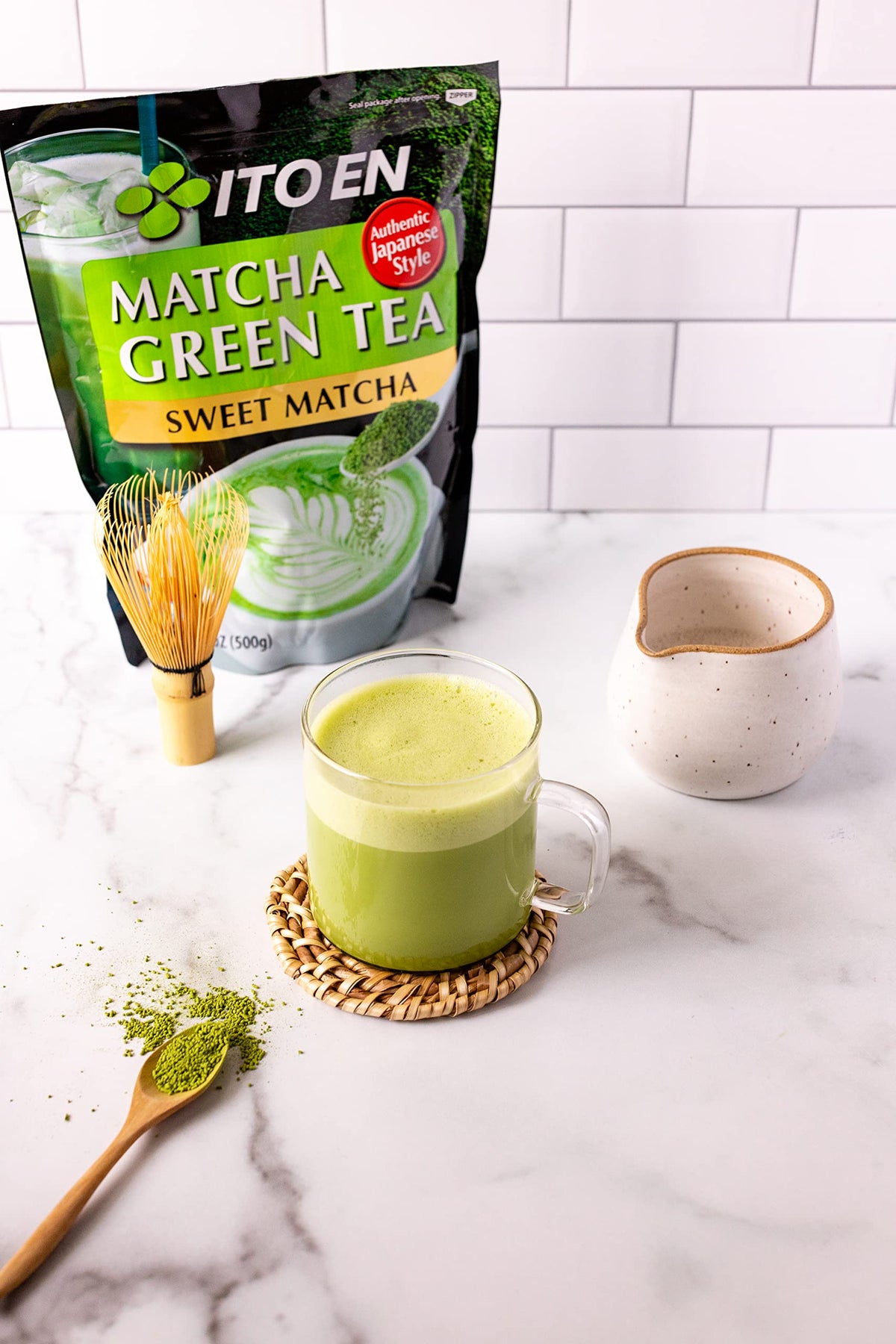 Ito En Matcha Sweet Powder scoop over a latte with creamy texture.