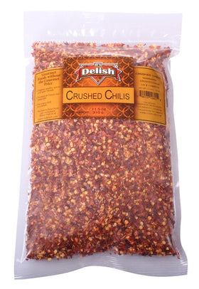 It's Delish crushed chilies bulk bag pour highlights easy seasoning for soups and sauces.