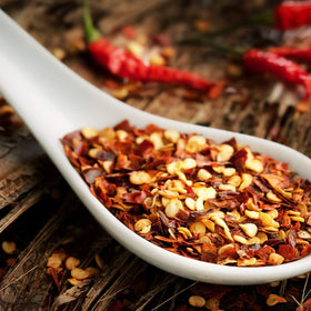 It's Delish crushed chilies pizza topping illustrates punchy heat on fresh-baked pies.