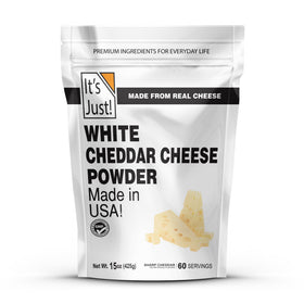 It's Just! white cheddar powder bottle pouring for quick creamy cheese sauce.