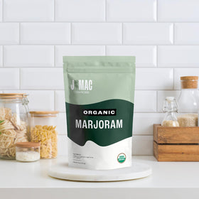J Mac Botanicals marjoram dried herb closeup, vibrant leaves ready to add to dishes.