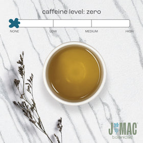 J Mac Botanicals steeping tea cup with inviting aroma.