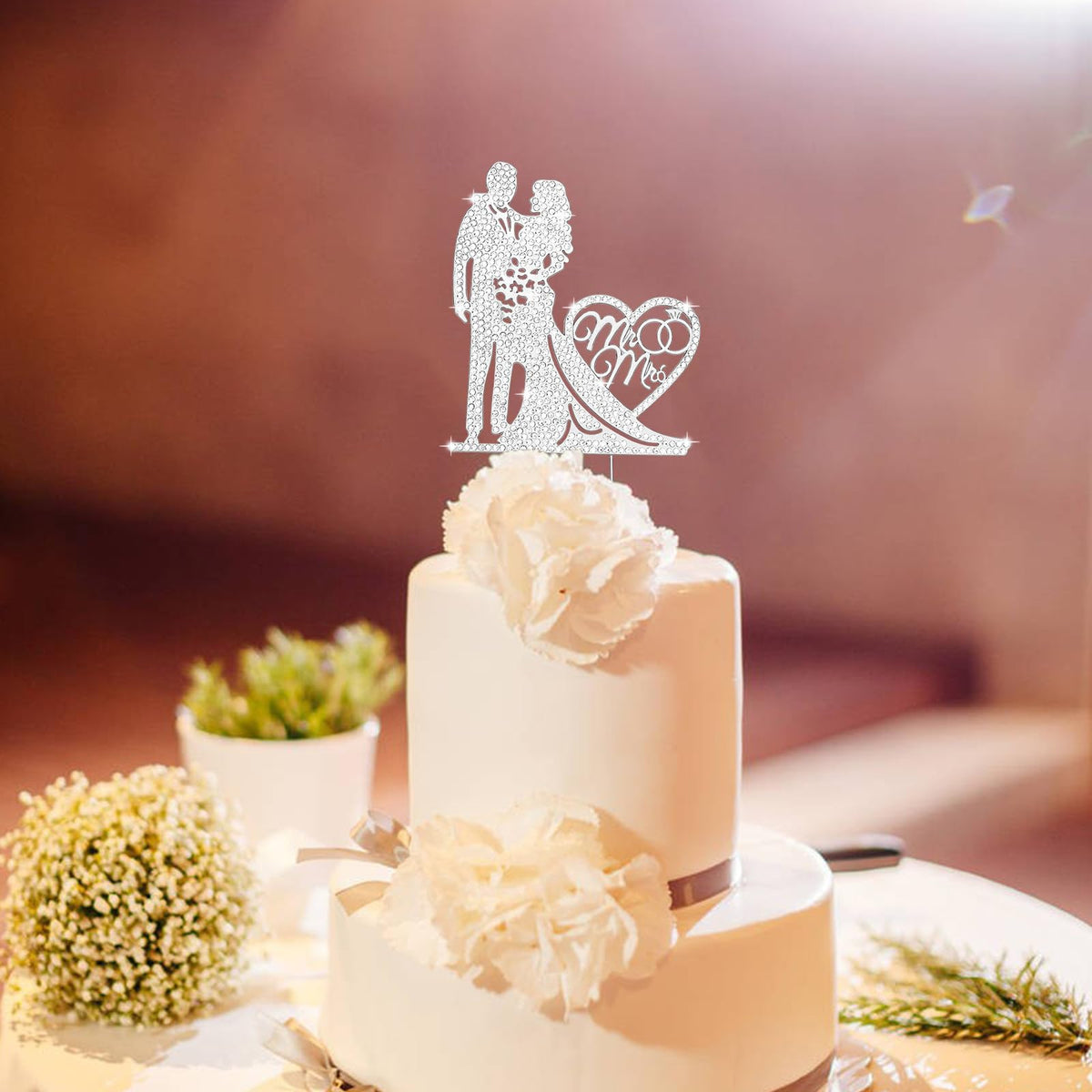 Jaciya rhinestone topper creates a radiant cake centerpiece.