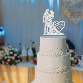 Jaciya silver wedding topper brightens any cake moment.