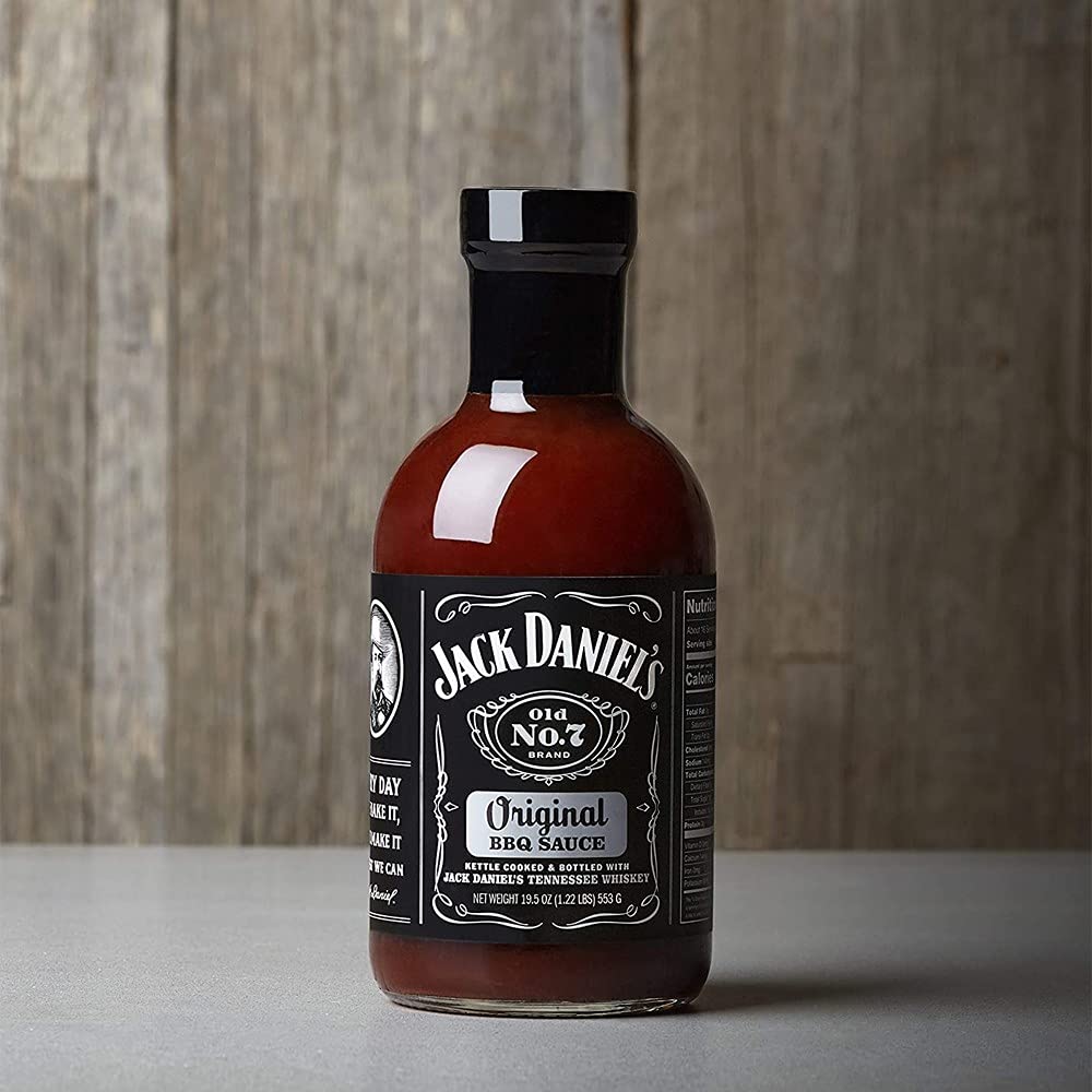Jack Daniel's sauce bottle pour, smooth glaze ideal for brushed BBQ dishes.