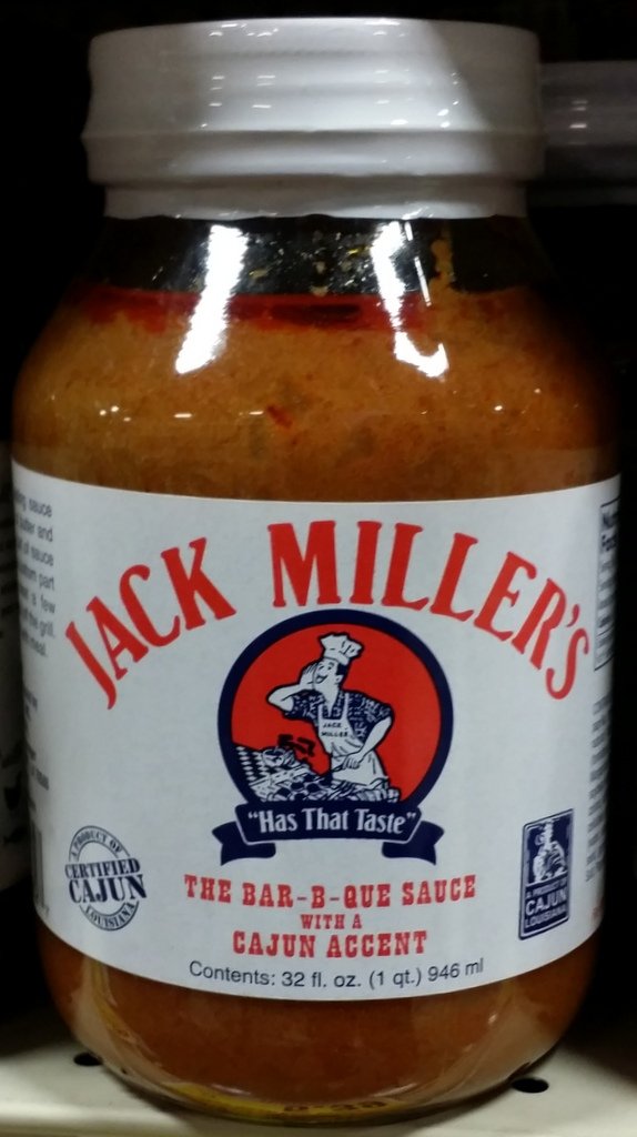 Jack Miller's Bar-B-Que Sauce Cajun Accent bottle adds bold flavor to grilled meats.