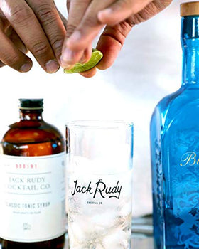Jack Rudy tonic bottle pour highlights aroma and balance.