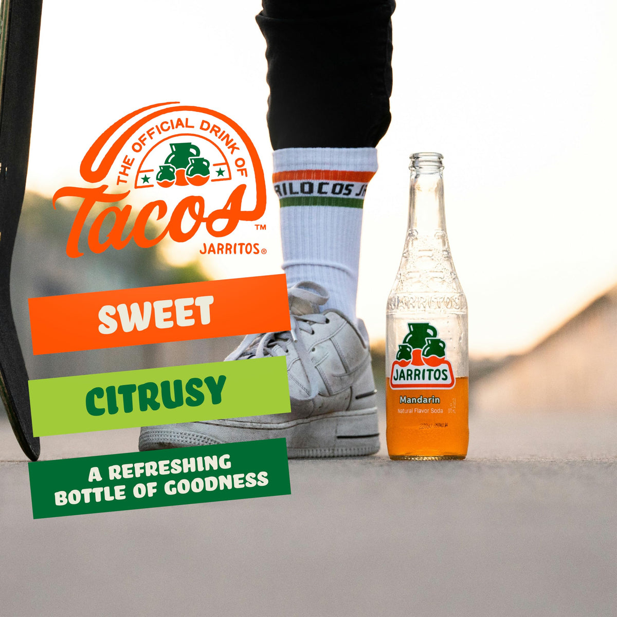 Jarritos Mandarin bottle tilt view captures fiesta-ready mood for parties and tastings.