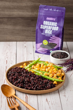 Jasberry Organic Purple Rice farm scene emphasizes sustainable farming and fair wages for farmers.
