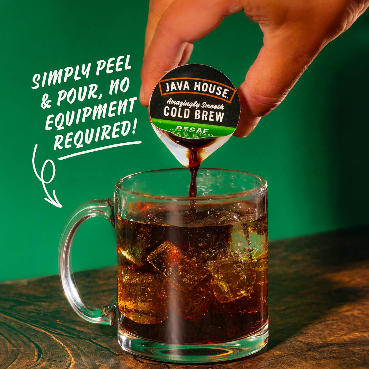 Java House peel-and-pour capsule open over ice for quick cold brew.