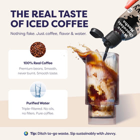 Javvy concentrate beside a glass of iced coffee highlighting cold brew versatility.