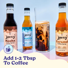 Javvy Caramel syrup bottle beside assorted drinks for flavor ideas.