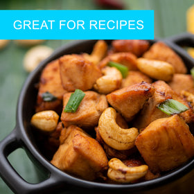 Jaybee's Roasted Salted Cashews in a bowl, ready to top salads or enjoy as a snack.