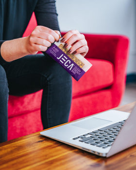 JECA bar showing vegan and gluten-free labeling on packaging.