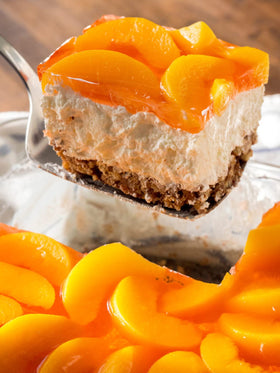 Jell-O Peach Gelatin Dessert served with peach slices for a colorful treat