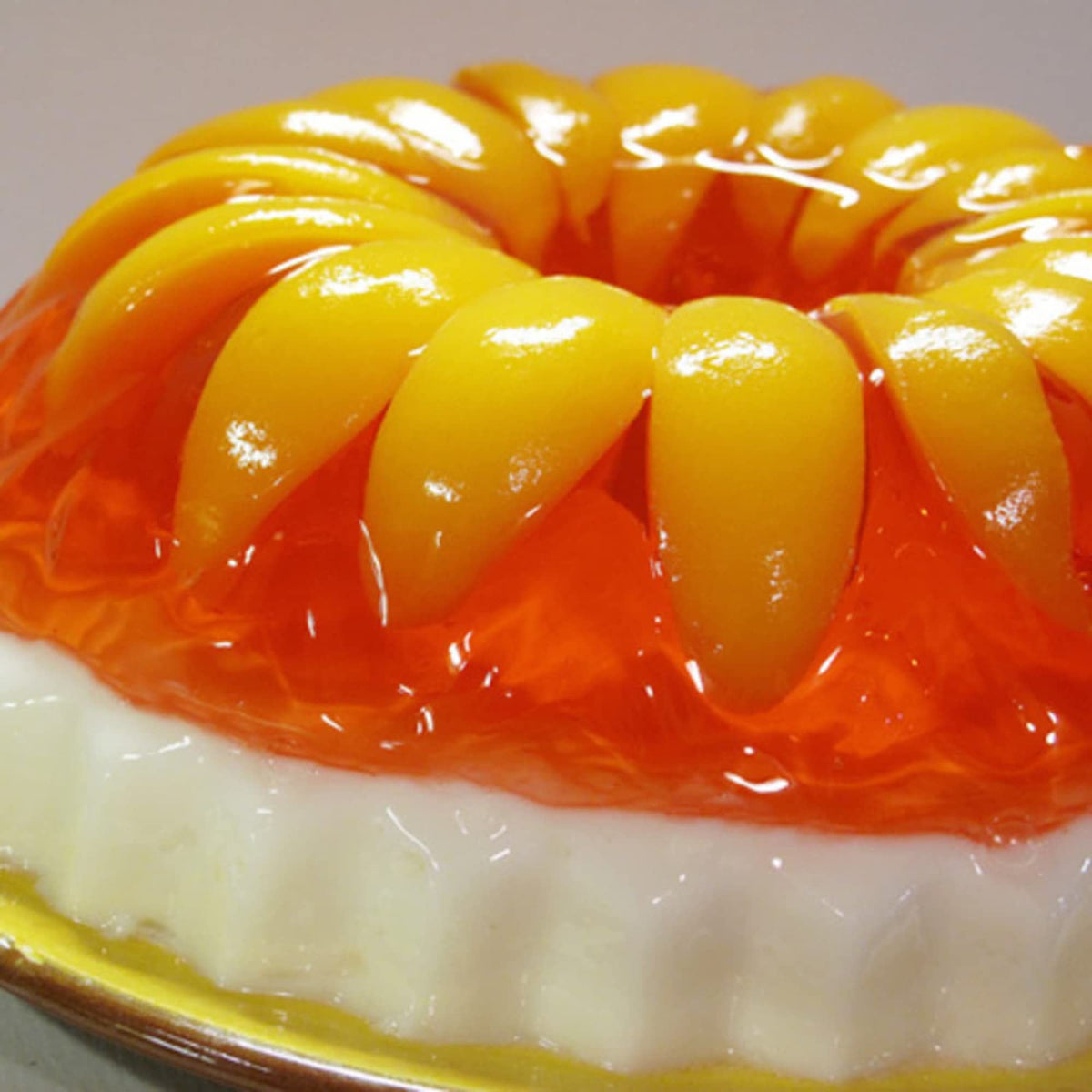 Jell-O Peach Gelatin Dessert set in a clear cup, ready to serve