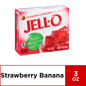 Pouring boiling water into JELL-O mix to dissolve it smoothly.