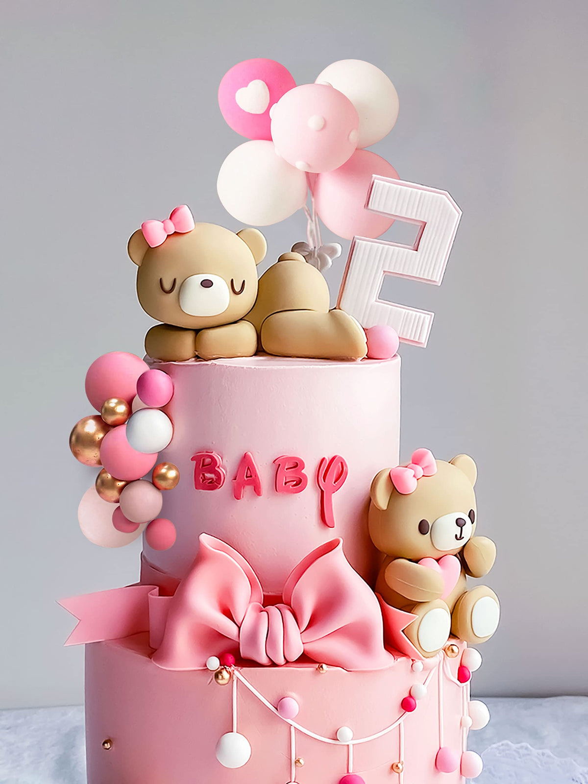 JeVenis bear cake decors provide cute focal ornaments for tiered cakes.