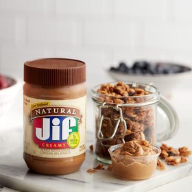 Jif Natural Creamy Peanut Butter spread on toast for a simple breakfast