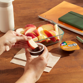 Jif To Go spread on rice cakes for a quick bite on the move.