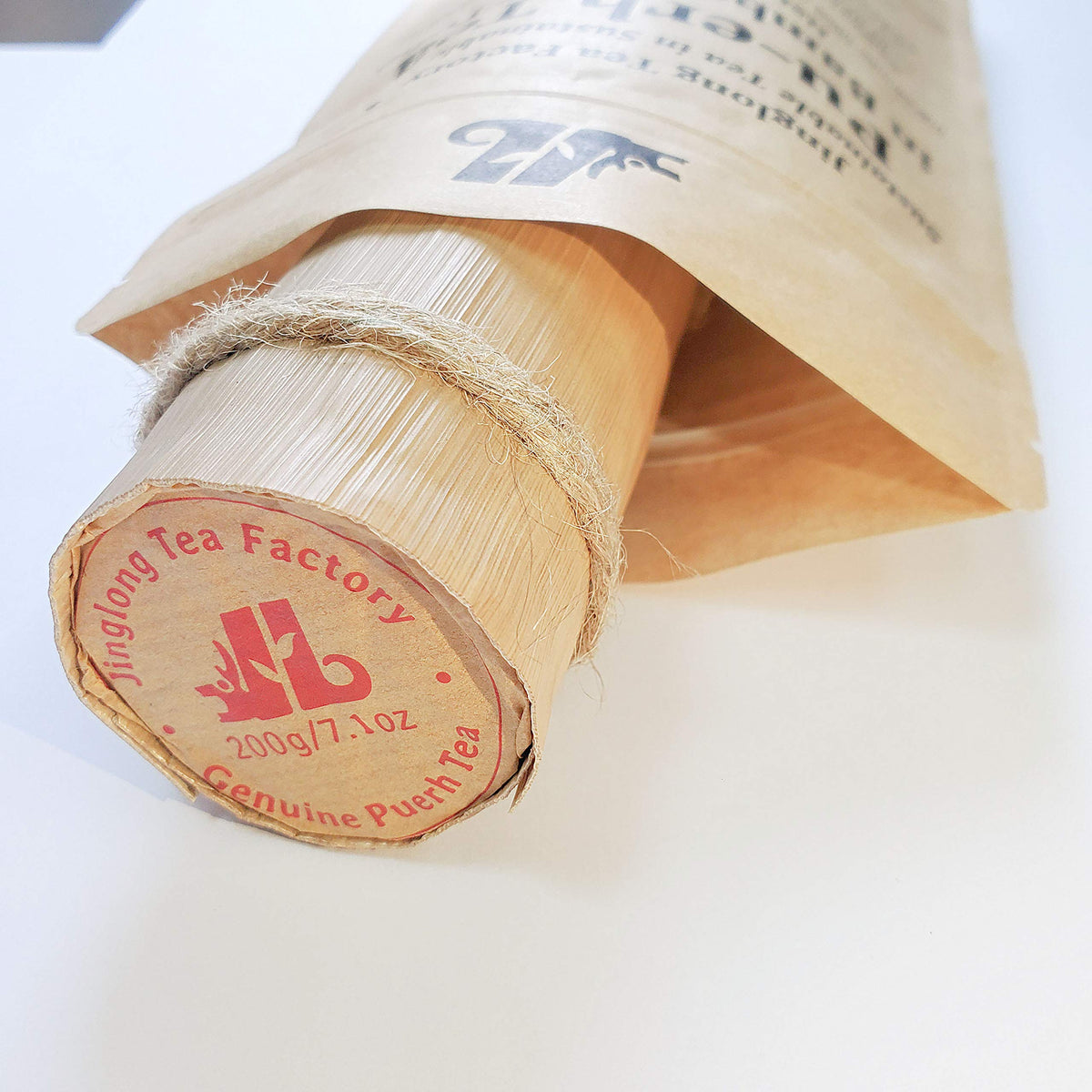 Jinglong Tea Factory eco-packaging featuring bamboo leaves for sustainability