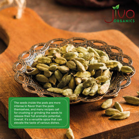 Jiva Organics cardamom pods with masala chai preparation for rich spice.