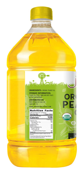 Jiva Organics peanut oil being poured, ideal for frying and baking with high smoke point.