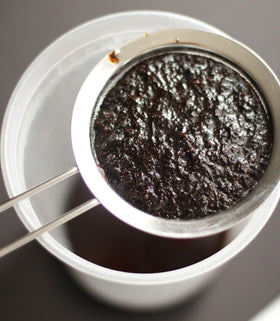 JL Gourmet Imports Vanilla Bean Paste jar open reveals vanilla specks