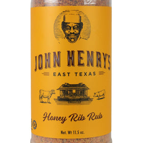 Applying John Henry's Honey Rib Rub as a dry rub before cooking
