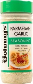 Johnny's Garlic Spread And Seasoning 10oz bottle on countertop, ready to elevate meals.