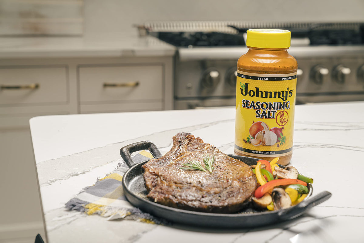 Johnny's Seasoning Salt kitchen scene suggests everyday cooking versatility.