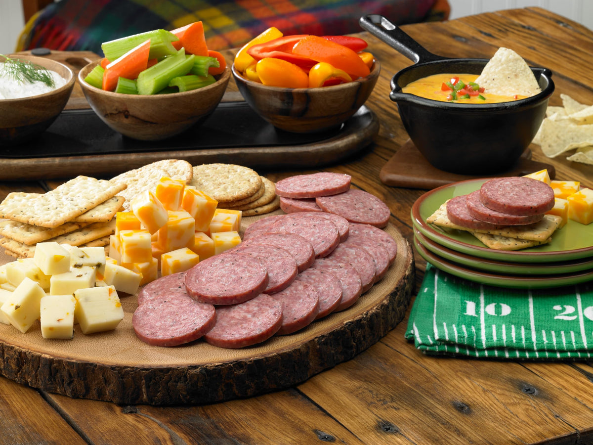 Johnsonville Summer Sausage slices on a cheese board for entertaining guests.