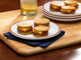 Johnsonville Summer Sausage charcuterie plate with cheese and pickles.