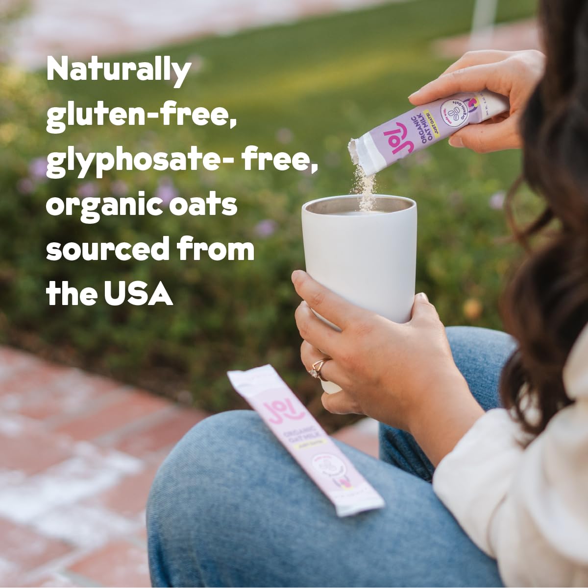 JOI oat milk powder pour into a glass with a smooth, ready-to-drink texture.
