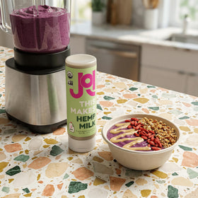 Squeezable JOI seed butter dispensed for toppings.