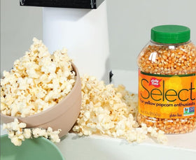 Jolly Time kernels pouring into air popper for hot theater flavor