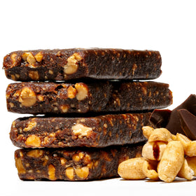 Close-up of chewy texture and visible nuts in a Jonesbar bar, ideal for on-the-go snacking.