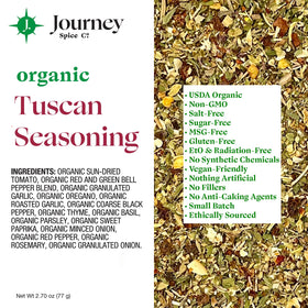 Close-up texture of Journey Spice Co. Organic Tuscan Seasoning with vibrant herbs.
