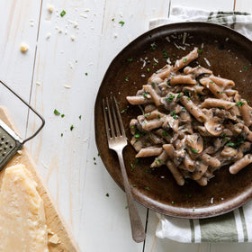 Jovial Cassava Penne Rigate cooked and plated with sauce showing firm bite.