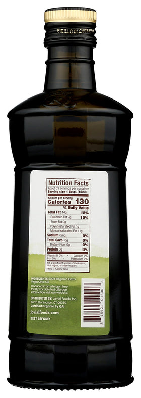Jovial Organic EVOO being poured over a fresh salad