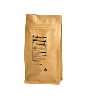 Jovvily Carob Powder being measured into a smoothie for a chocolate-free treat.