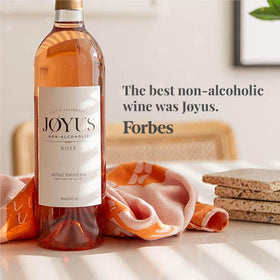 Joyus non-alcoholic rosé label close-up showing premium craftsmanship and awards.