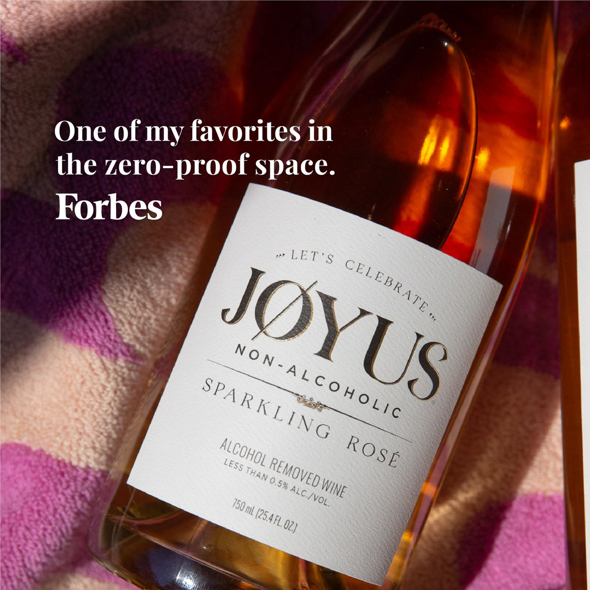 Joyus Sparkling Rosé glass showcases color and aroma for festive moments.