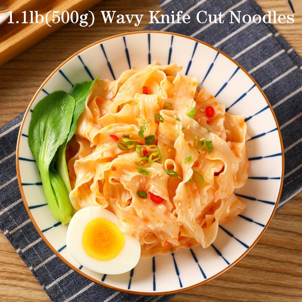 Uncooked wide JTEDZI noodles close-up, ideal for stir-fries