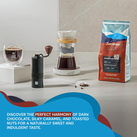 Juan Valdez Sierra Nevada beans in scoop, ideal for consistent grind sizes.