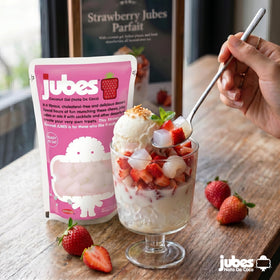 Jubes boba tea topping with strawberry jelly cubes and coconut gel.